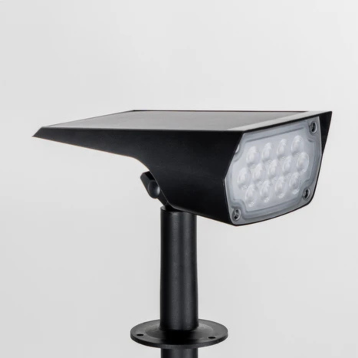 Close-up of the black spotlight head on its stake against a plain background, showing the grid of LEDs behind a clear cover. 4