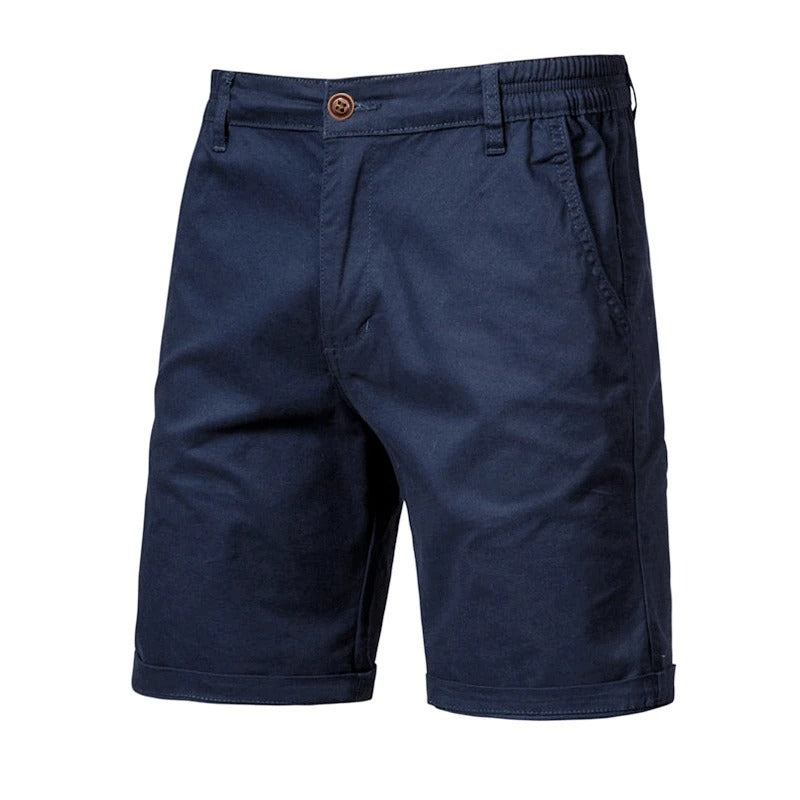 Front view of navy blue shorts with a brown button, elastic side waist and rolled cuffs 10