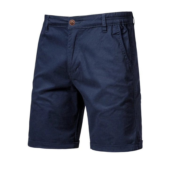 Front view of navy blue shorts with a brown button, elastic side waist and rolled cuffs 10