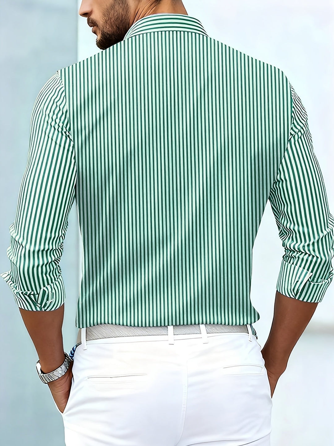 Green and white striped shirt, back view on a model.