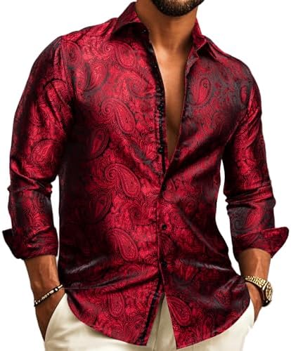 Model wearing the long-sleeve shirt in red and black paisley jacquard, sleeves cuffed, with bracelet and gold watch.