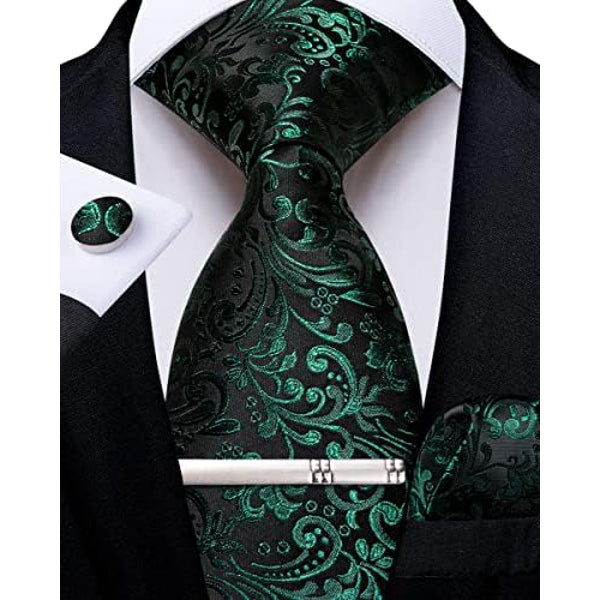 Black tie set with emerald green paisley and floral pattern, shown with matching cufflink, pocket square and silver tie clip.