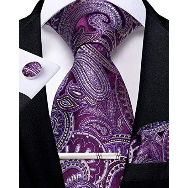 Purple paisley tie set displayed with matching cufflink, pocket square and silver tie clip.