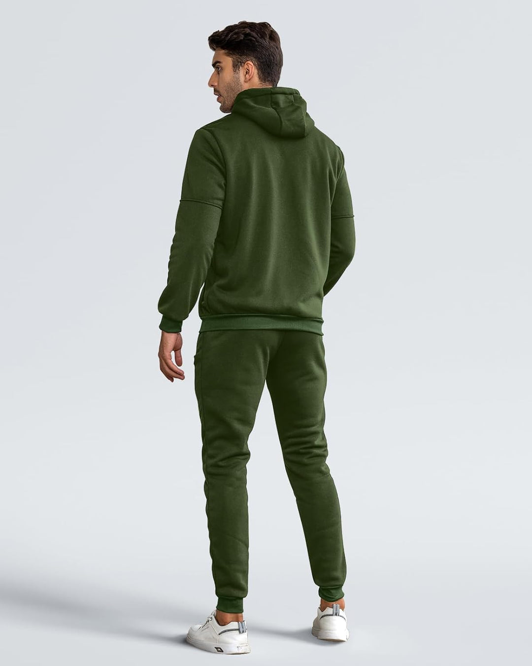 Back view of a man wearing the olive green hoodie and matching jogger pants 7