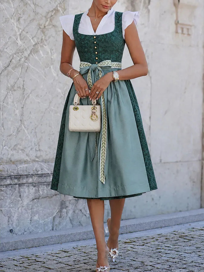 Green woven dress another view with curved front hem and lace-up detail.