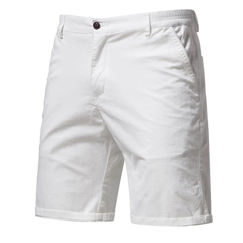 Front view of white shorts with a dark button, slanted side pockets and rolled cuffs 9