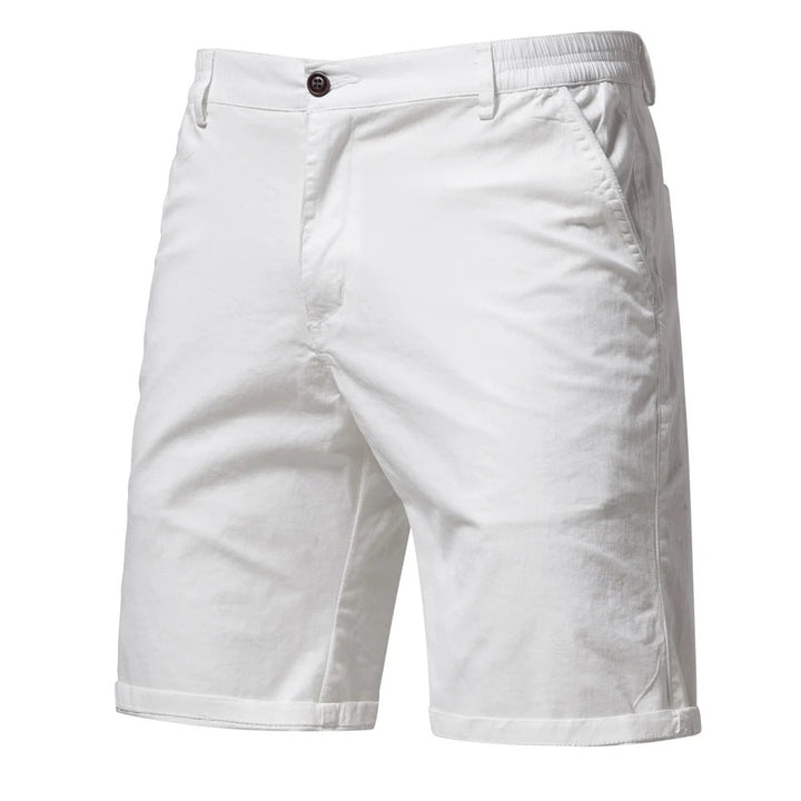 Front view of white shorts with a dark button, slanted side pockets and rolled cuffs 9