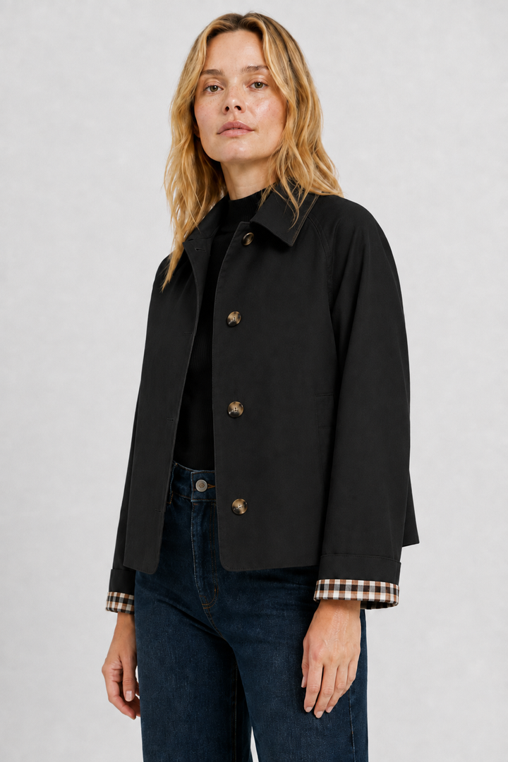 Women's black lightweight jacket, another view with the button front and checked cuff lining.
