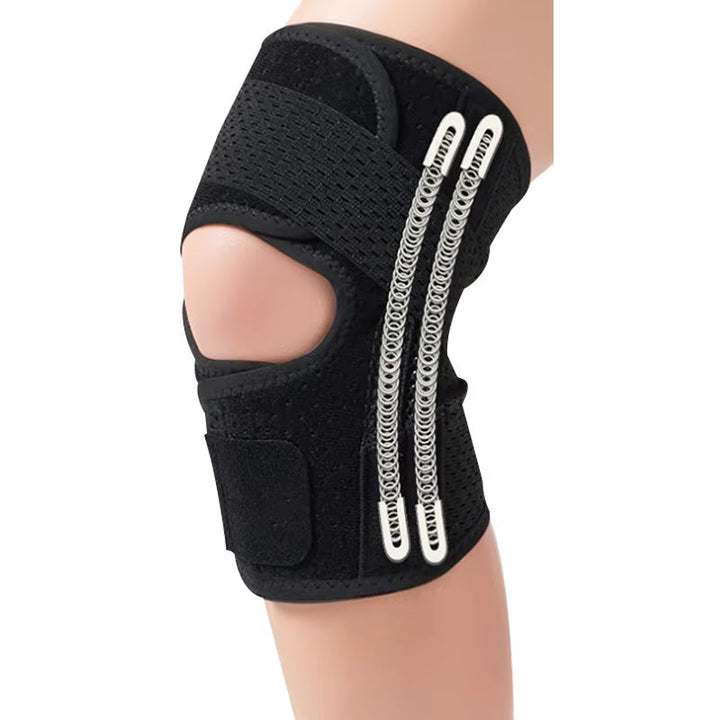 Black mesh knee brace with an open kneecap, two vertical metal springs along the side and a wide fastening strap, on a leg. 11