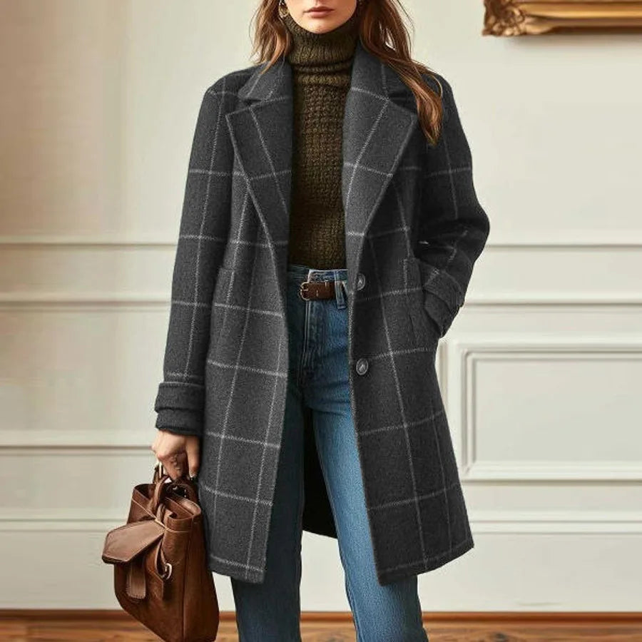Woman wearing the charcoal gray checked coat with one hand in pocket, standing in a paneled room 5