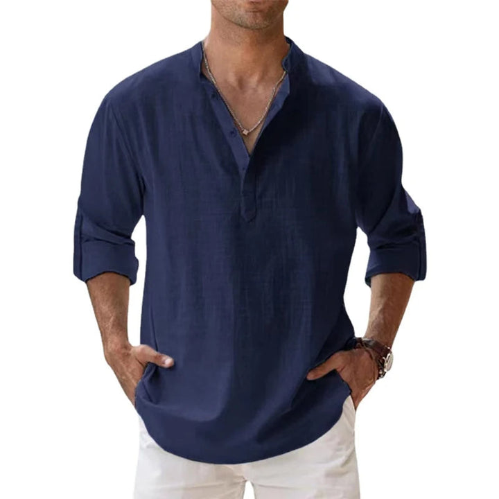Men's linen Henley shirt in dark navy blue with rolled sleeves and a half-button placket.