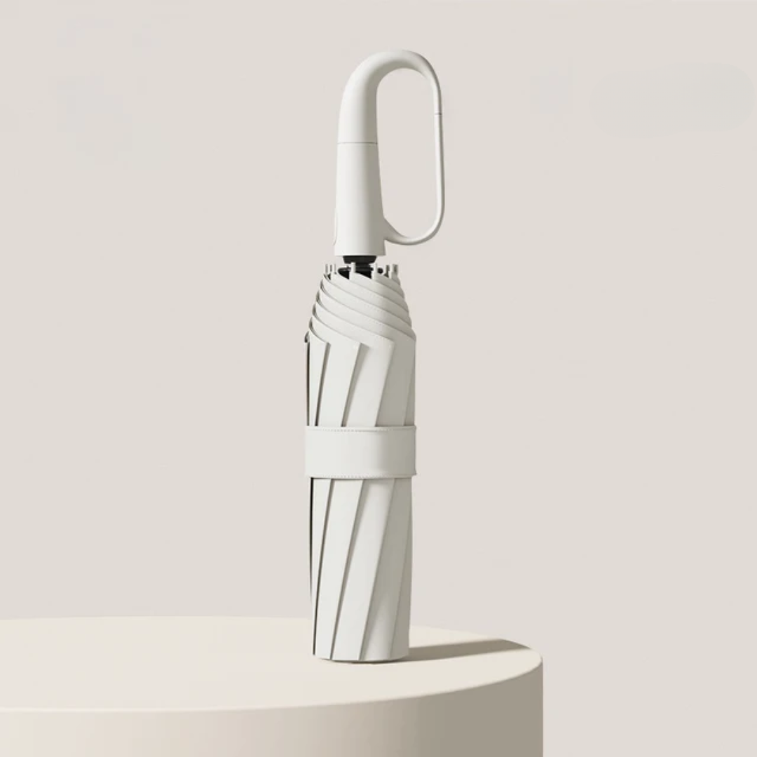 Closed folding umbrella in White with an oval hook handle and fabric strap.