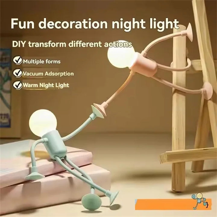 Pink and green figure lights climbing a wooden easel, with a feature list for decoration, vacuum adhesion and warm light 5