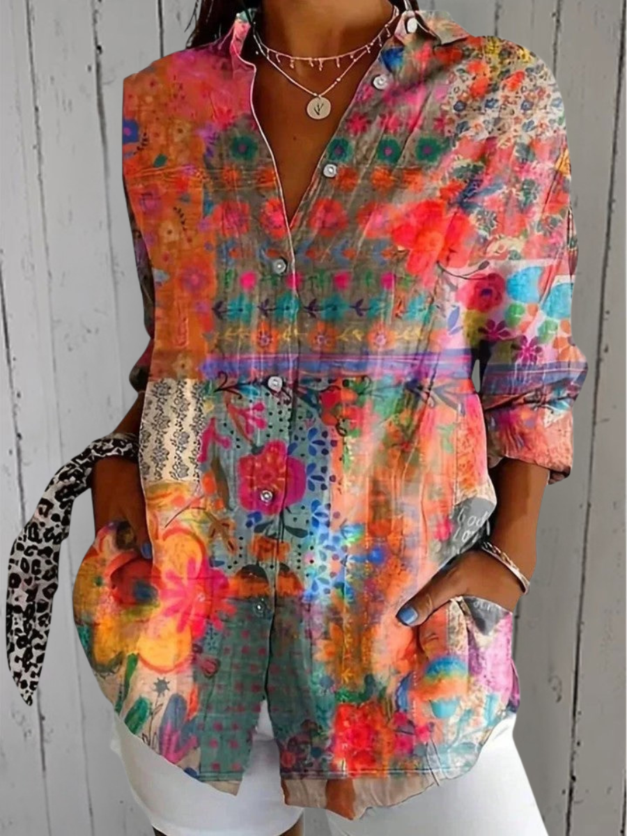 Anica blouse detail with a patchwork floral print in orange, pink, teal and blue.
