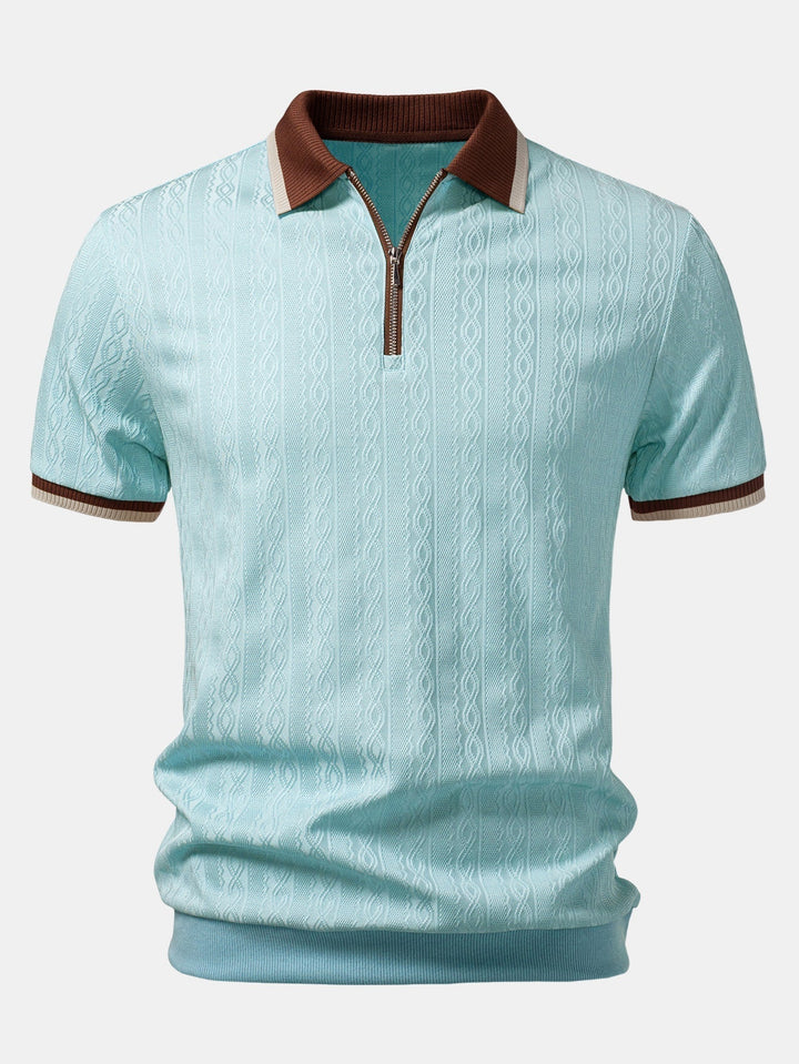 Light blue polo with brown contrast collar, cream-and-brown striped cuffs, quarter zip, and textured cable knit.