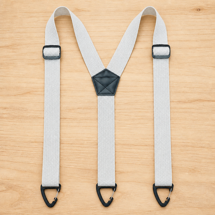 Light gray Y-back suspenders laid flat with three black clip ends and a black center patch.