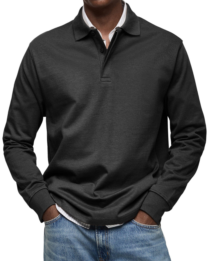 Man wearing the long sleeve polo shirt in charcoal black, another view.