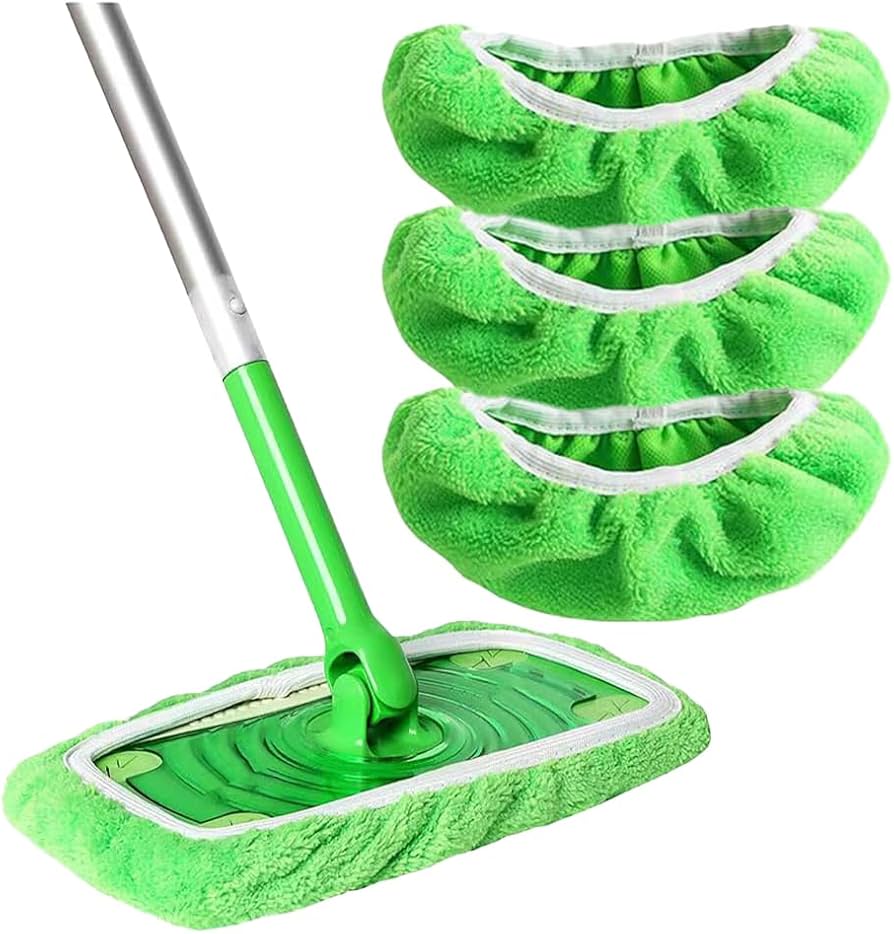 Green plush mop pad fitted on a green and silver flat mop, with three more green pads stacked beside it.
