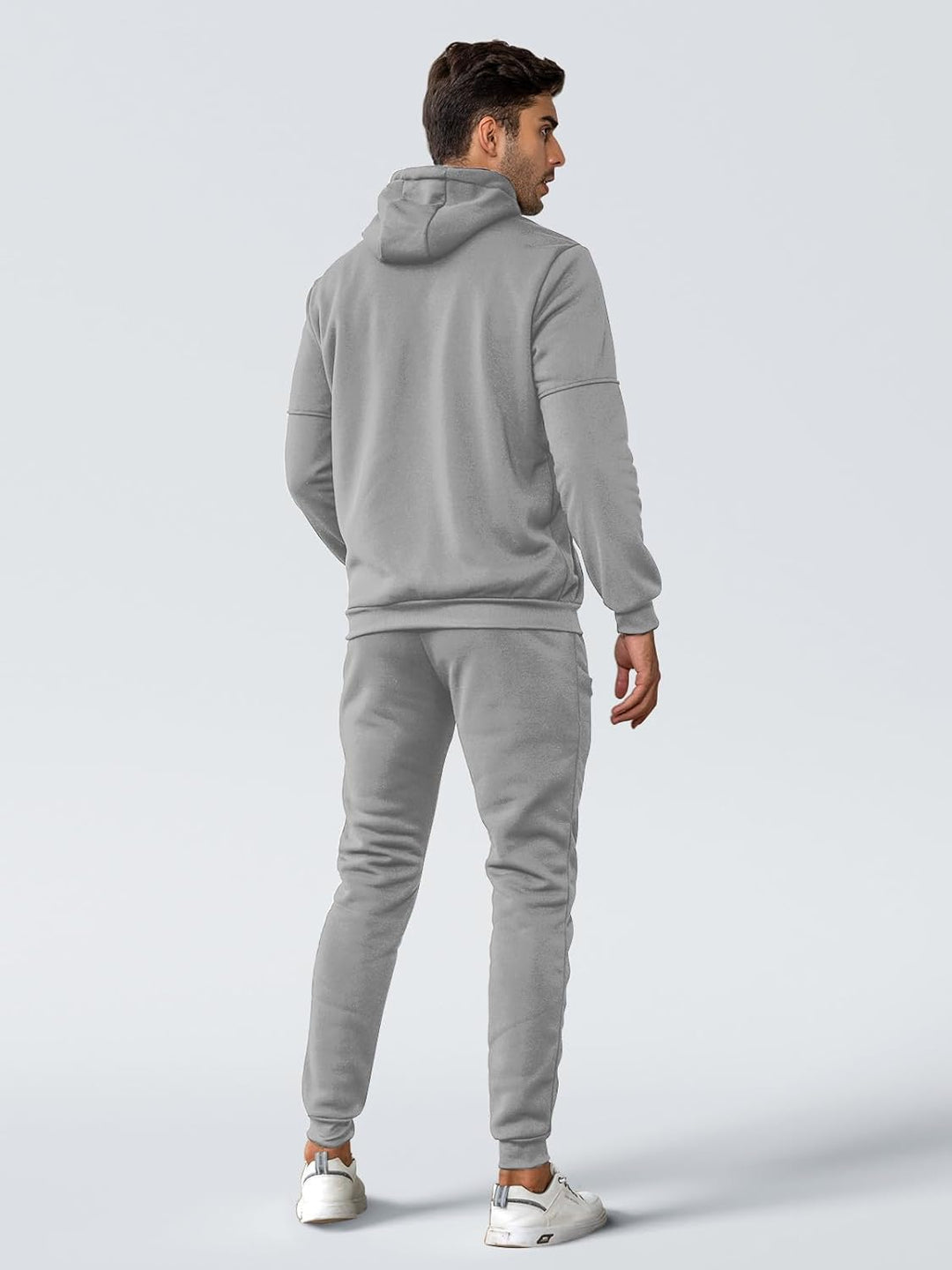 Back view of a model wearing the light gray hooded tracksuit with ribbed hem and cuffed joggers 28