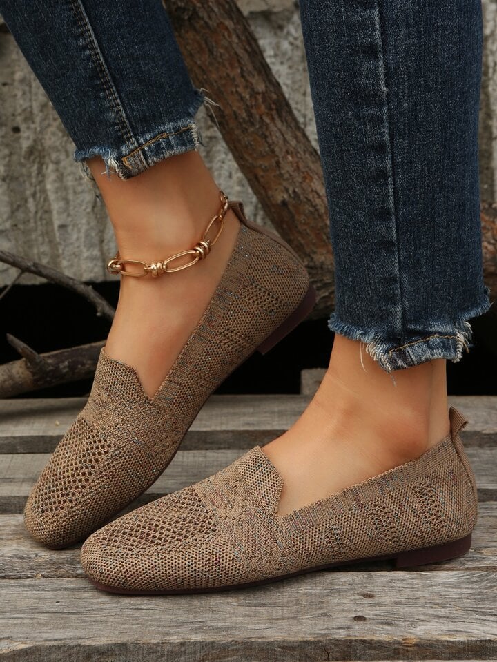 Brown knit slip-on flats with mesh panels and a heel pull tab, another view.