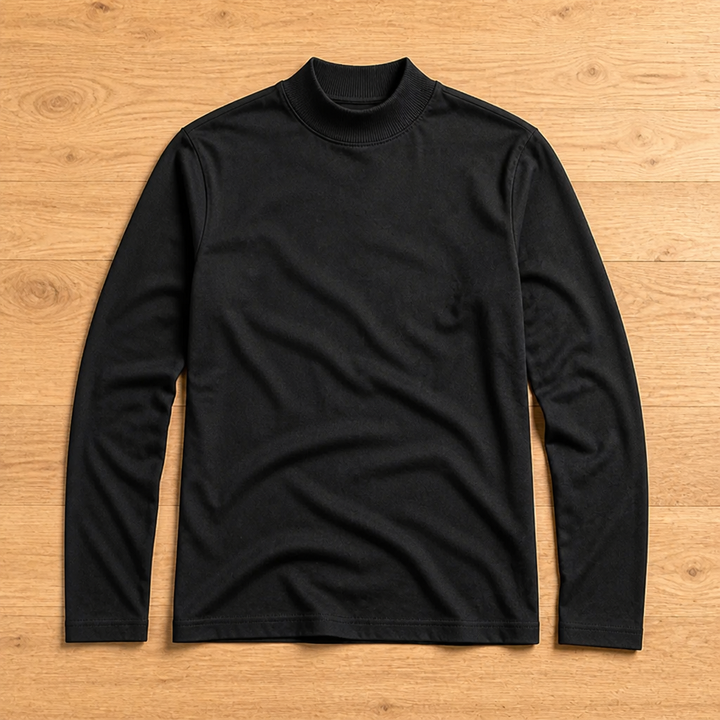 Black long sleeve tee with ribbed high collar laid flat, front view, on a light wood floor.