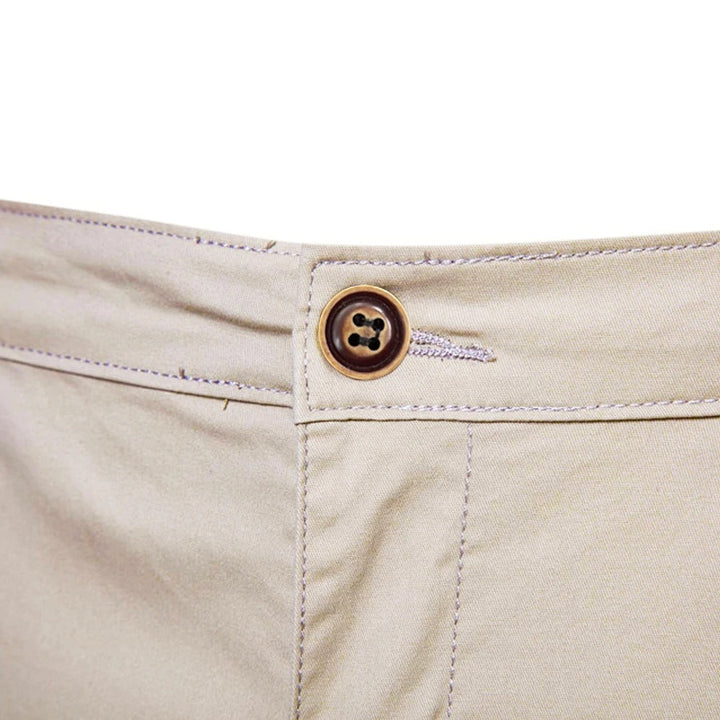 Close-up of the brown four-hole button, buttonhole and fly stitching at the waist 5
