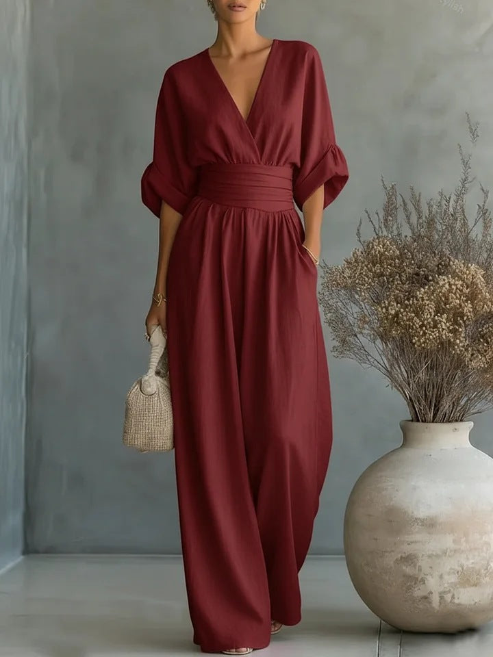 Burgundy women's jumpsuit full-length front view with wide legs.