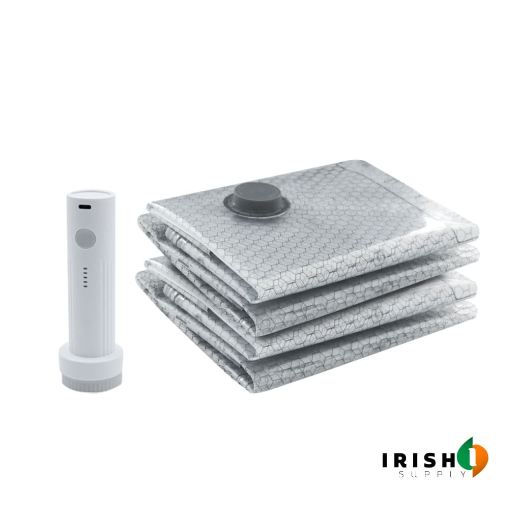 White pump next to folded clear compression bags with a valve on the top bag.