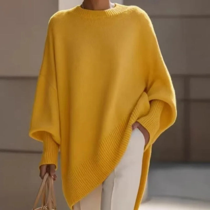 Bright yellow slouchy knit sweater with ribbed cuffs and hem, worn with white pants and a handbag 6