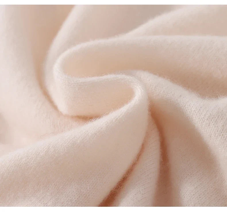 Close-up of soft cream knit fabric swirled to show its fuzzy texture 6