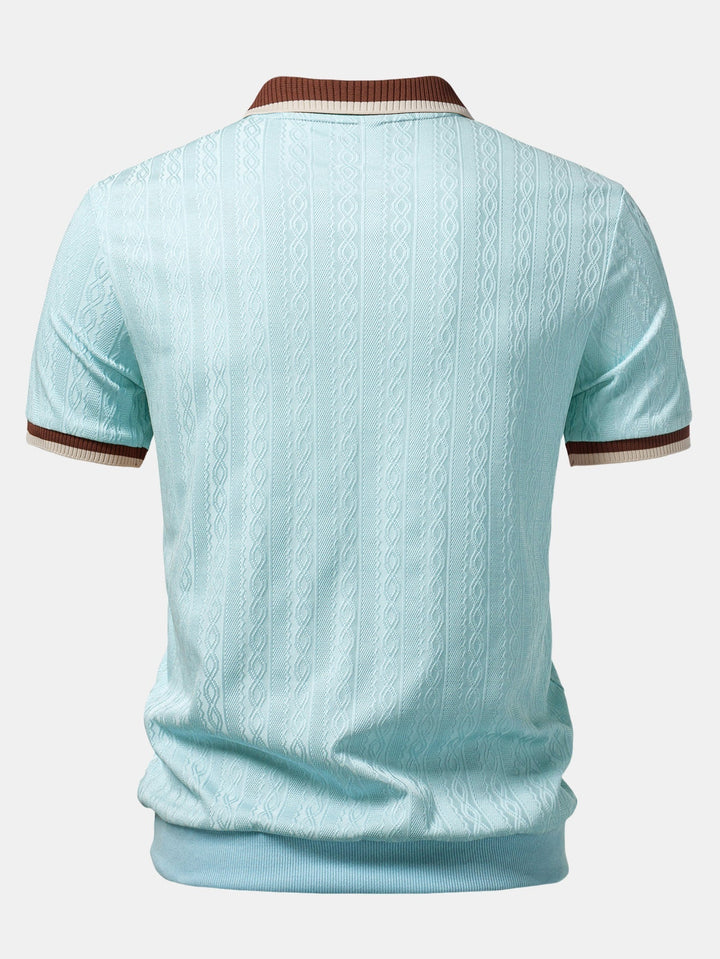 Light blue textured knit polo from the back showing the vertical cable pattern, striped collar trim, sleeve cuffs, and ribbed hem.