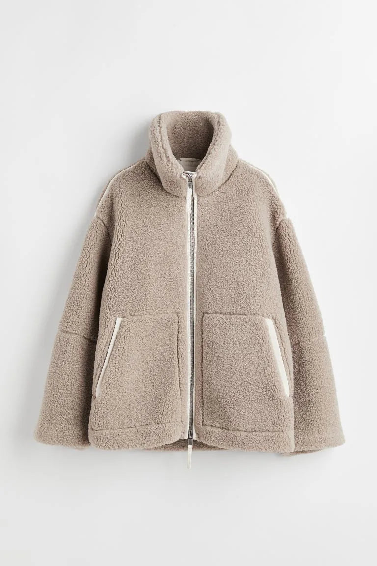 Taupe fleece zip coat laid flat, showing the stand collar, patch pockets and cream trim 6