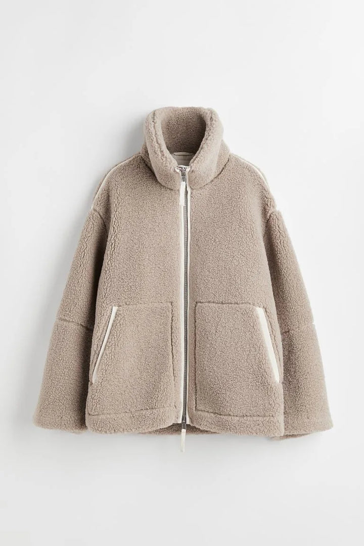 Taupe fleece zip coat laid flat, showing the stand collar, patch pockets and cream trim 6