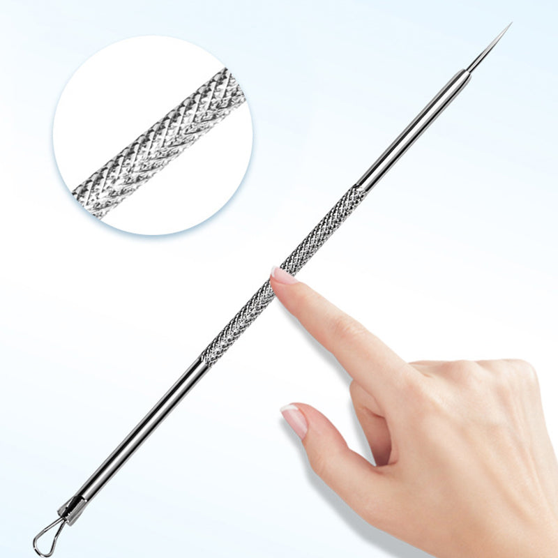 A hand holds one needle-tip pick with a textured knurled grip and loop end, with a magnified circle showing the grip pattern. 10