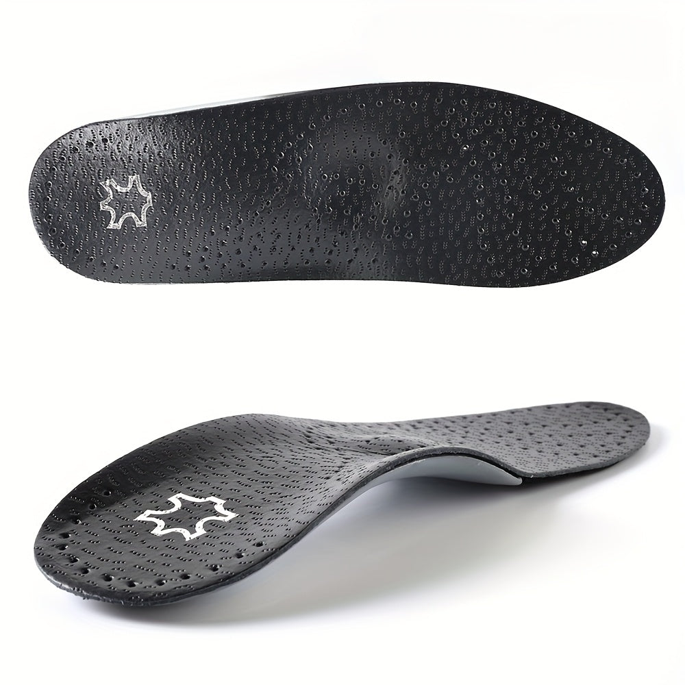 Pair of black perforated insoles from another view, showing the textured top surface and the curved arch profile.