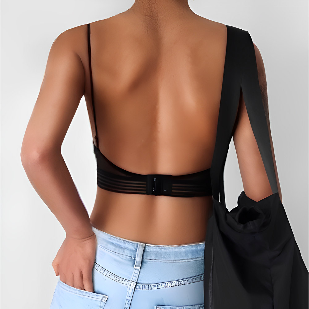 Back view of a model wearing the black bralette with thin straps, a low open back and a striped band with hook closure. 2