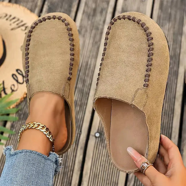 Brown leather slip-on sandals with a suede-like upper, another view with cushioned insole.
