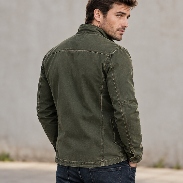 Kylian olive green jacket seen from behind on a model outdoors.