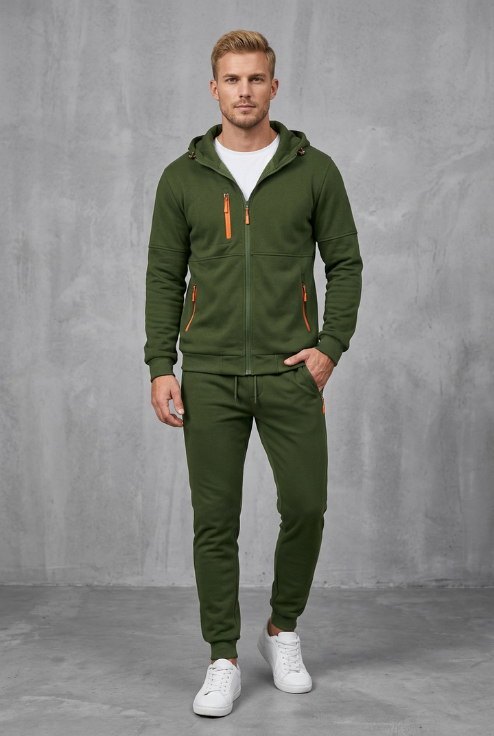 Front view of the olive green zip hoodie and joggers with bright orange zippers on pockets 6