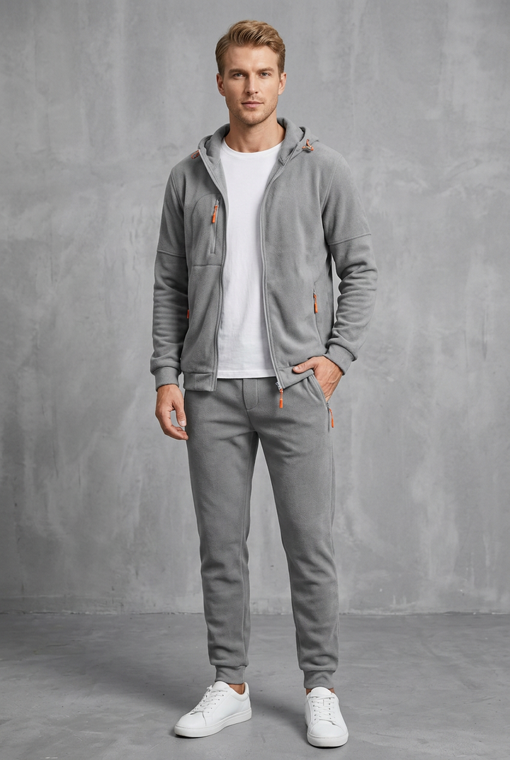 Front view of the light gray soft fleece zip hoodie and joggers with orange zipper pulls 10