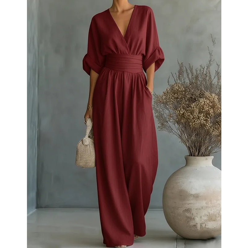 Another view of the burgundy women's elegant linen jumpsuit with a V-neckline and wide-leg drape