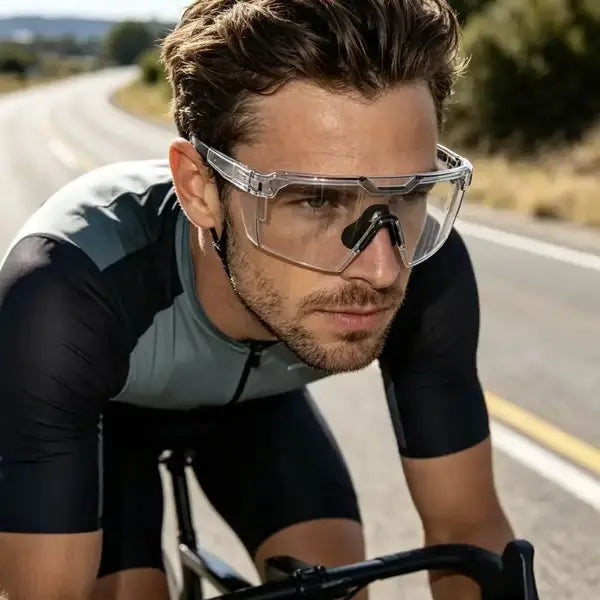 Black SunShift Tactical Sunglasses detail with nearly transparent lenses on a cyclist.