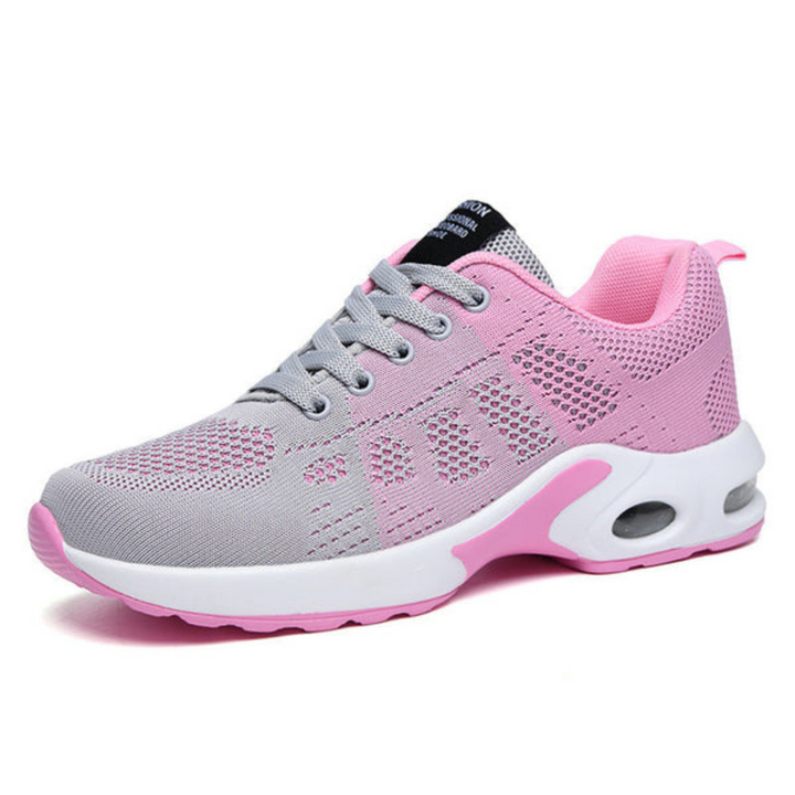 Side view of a two-tone gray and pink mesh sneaker with gray laces, a white sole and a heel air cushion window. 5