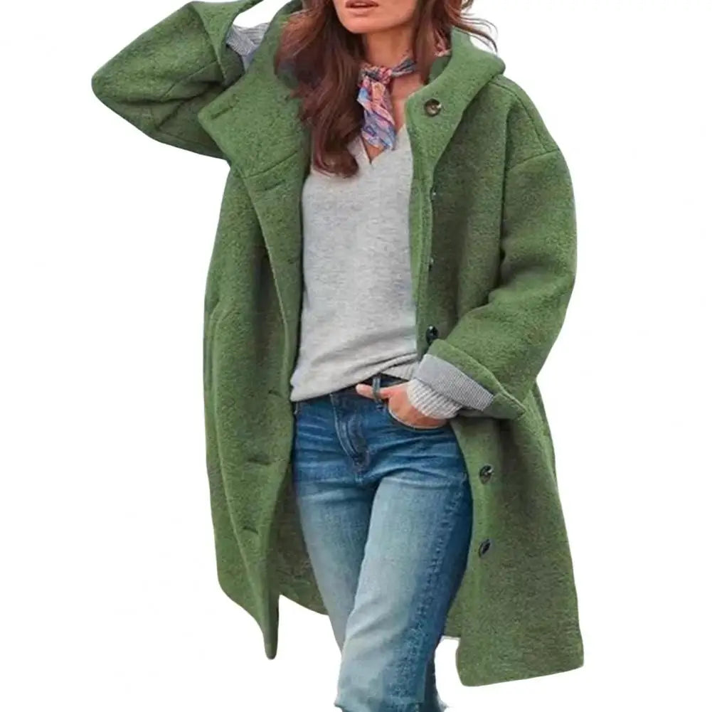 Green hooded coat on a plain white background, worn with scarf, gray top and jeans 7