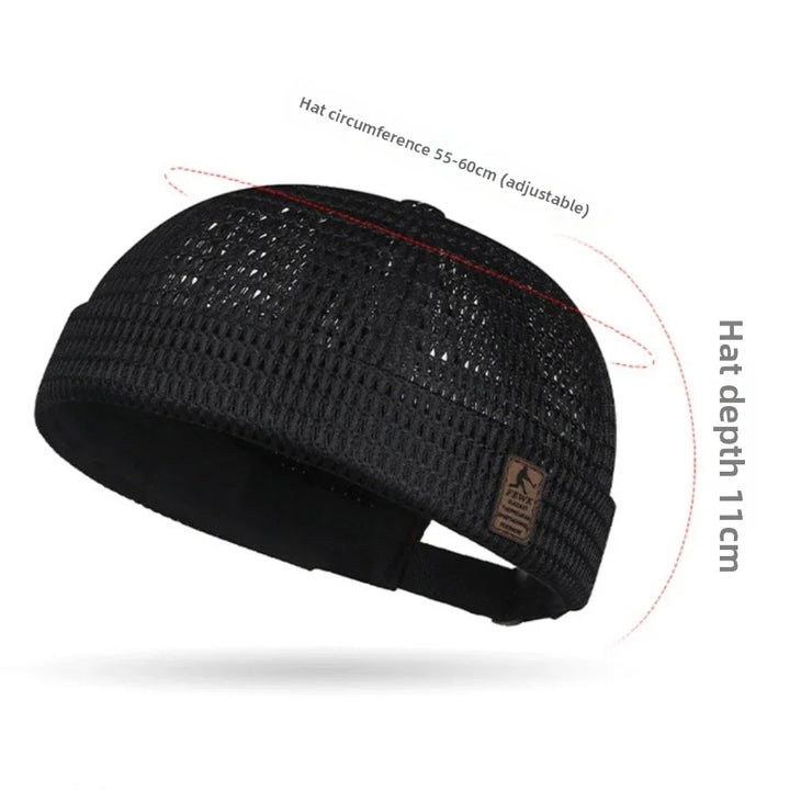 Black mesh brimless cap shown from the side with circumference and depth measurement lines 7