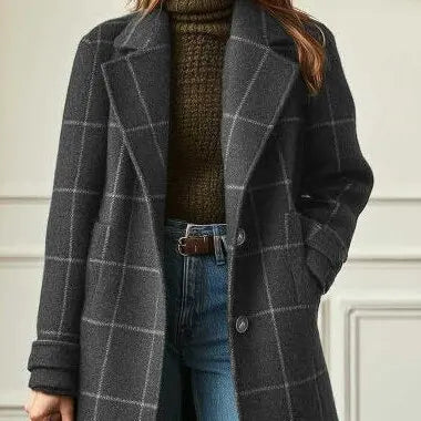 Cropped view of the gray checked coat showing two buttons, a cuff strap and side pocket 7