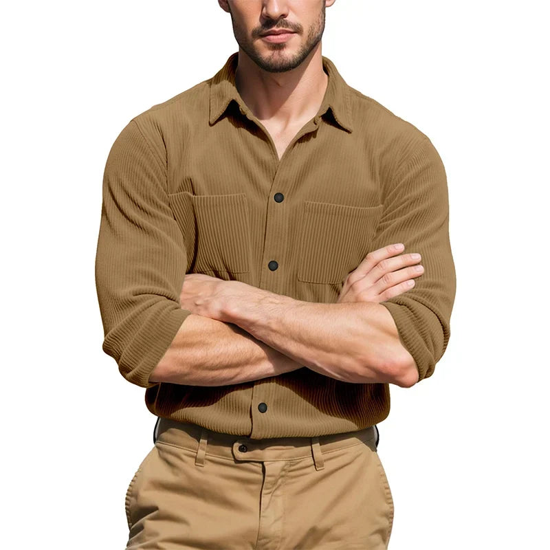 Model with arms crossed wearing the tan ribbed shirt with rolled sleeves and khaki pants 7