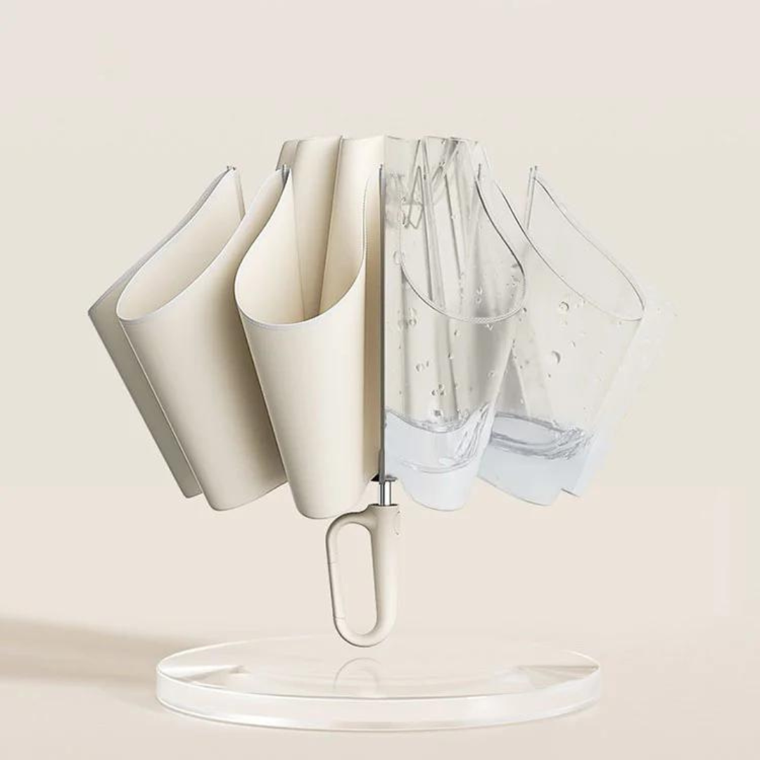 Umbrella folded inside out with the cream wet side tucked within and water collected inside.