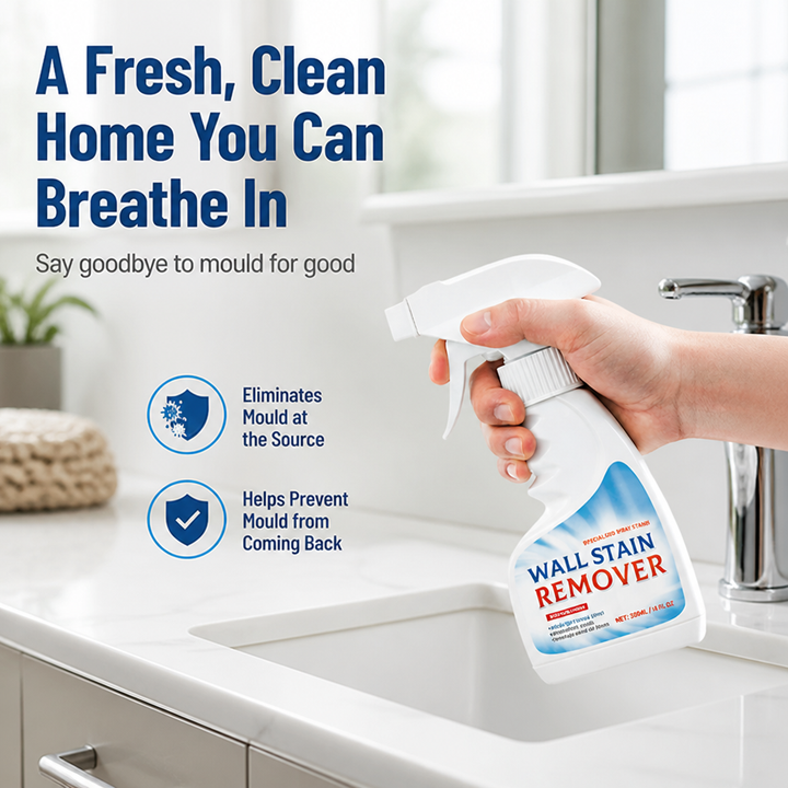 Hand holding the spray bottle over a white bathroom sink and chrome faucet, another view.