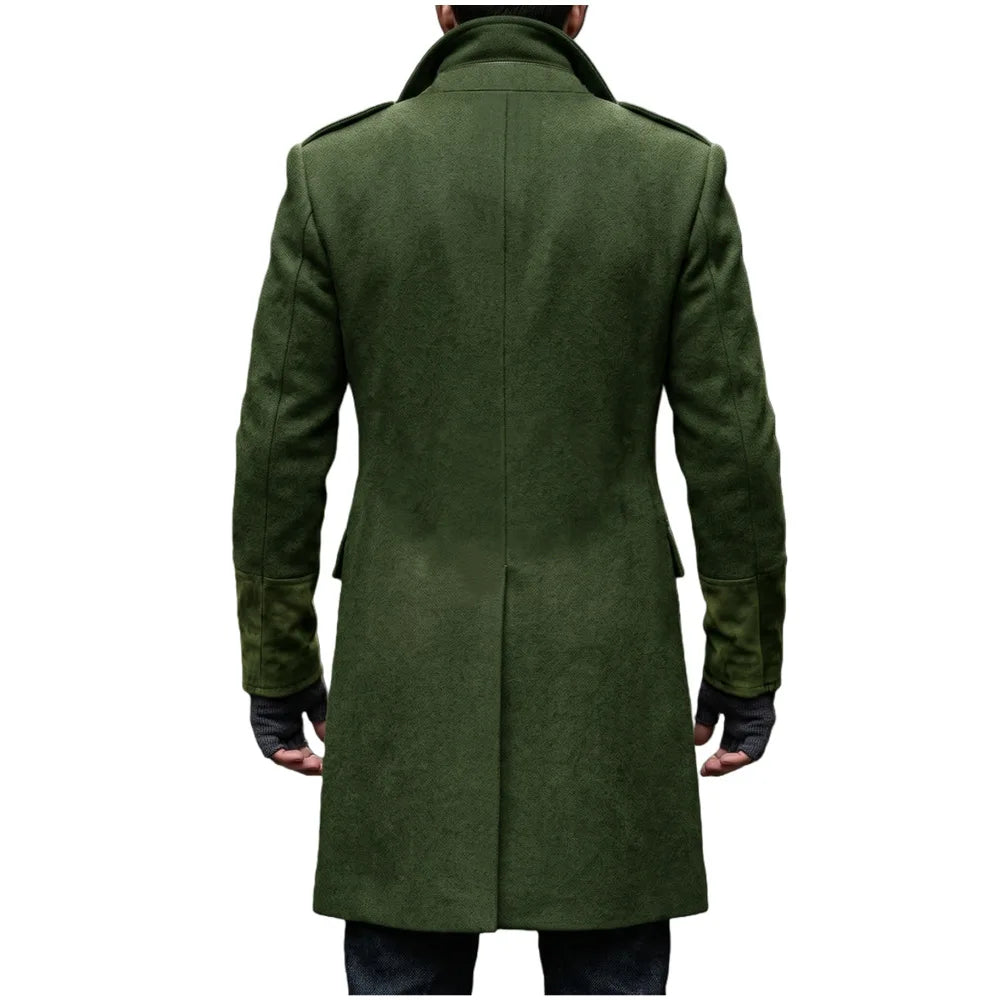 Back view of the green overcoat on a model, showing the center seam, shoulder epaulettes and suede-look cuffs 7